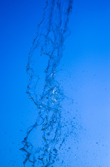 transparent falling water vertical flows, close up