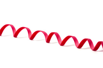 Wavy red ribbon isolated on white background.