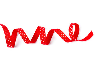 Wavy polka dot red ribbon isolated on white background.