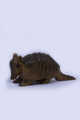 wood armadillo in a white background 