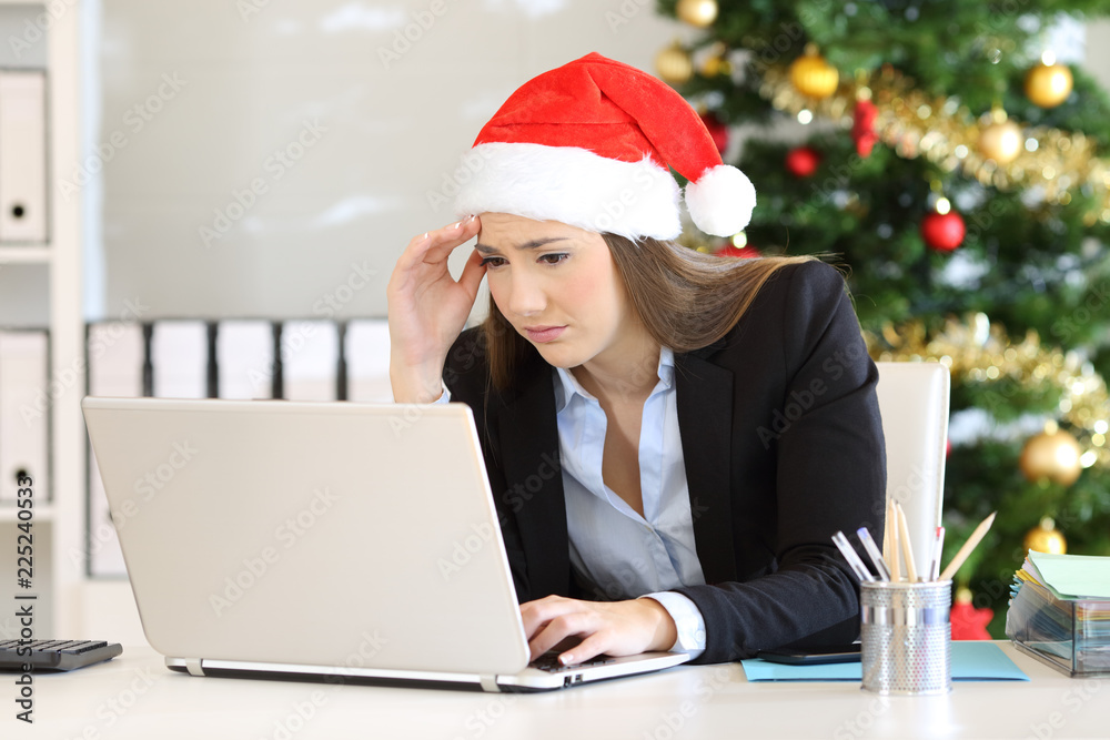 Wall mural Worried employee working at office in christmas - Wall murals