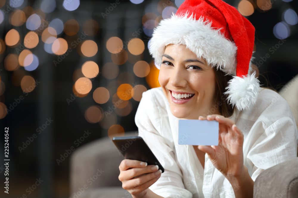 Sticker woman showing a blank credit card on christmas