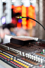 Mixing console of light equipment operator at the concert. Sound recording studio mixing desk with engineer or music producer