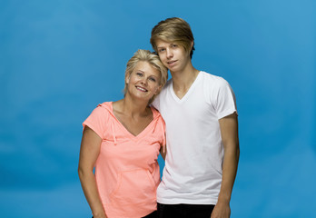 Obraz premium Happy and smiling mother and son in a hug. Loving family