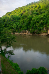 mountain slope on jungle river	