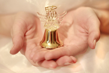 Christmas angel in hands. Angel. Christmas angel decoration.
