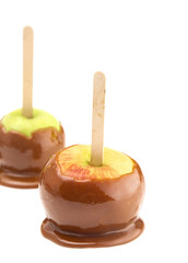 Dipped Homemade Caramel Apples on a White Background