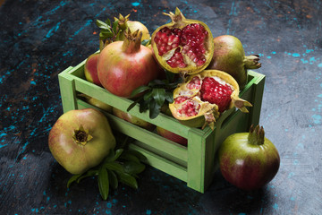 Ripe pomegranate fruit, opened with red seeds
