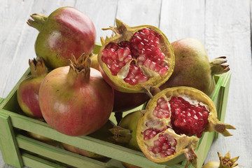 Ripe pomegranate fruit, opened with red seeds