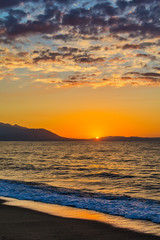 Fototapeta premium Early morning , dramatic sunrise over sea and mountain. Photographed in Asprovalta, Greece.
