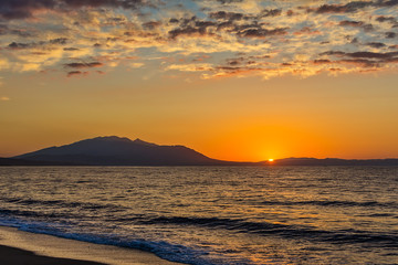 Naklejka premium Early morning , dramatic sunrise over sea and mountain. Photographed in Asprovalta, Greece.