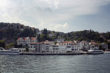 Fototapeta na wymiar View of big motorboats, buildings on European side and Bosphorus in Istanbul.