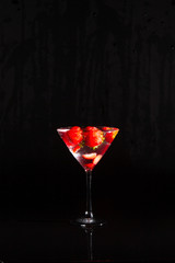 vodka strawberries in martini glass
