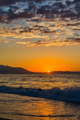Naklejka premium Early morning , dramatic sunrise over sea and mountain. Photographed in Asprovalta, Greece.