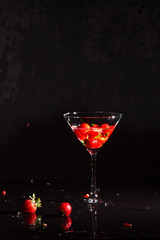 vodka strawberries in martini glass