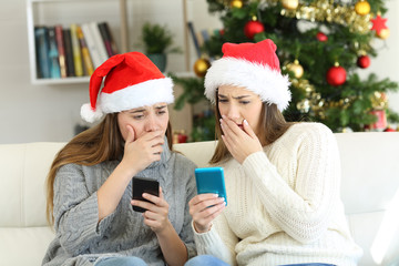 Worried women reading bad news in christmas