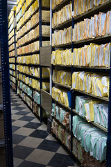 Stacks of papers and folders in library Office Files