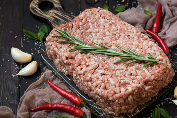 Raw meat with fresh herbs and pink Himalayan salt