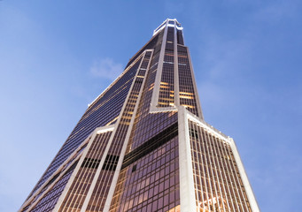 Obraz premium Moscow City. Glass facades of a skyscraper on a bright sunny day in a blue sky.