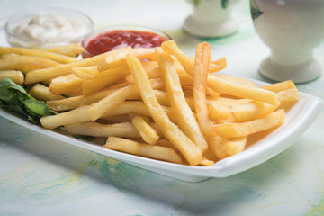 French fries with ketchup and mayonnaise