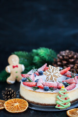 Delicious Christmas ginger cheesecake with fresh berries decoration