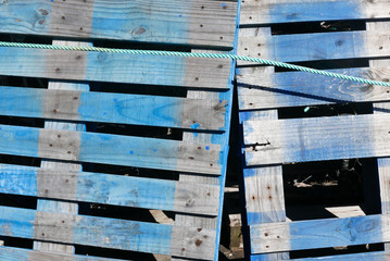 Backgroound of Colorful blue pallets with rope