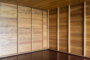 Corner of empty room. wooden walls and flooring, interior design elements
