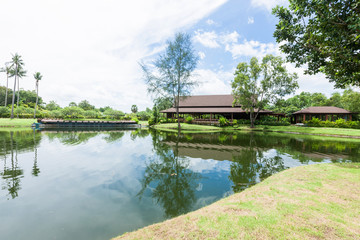 Obraz premium resort villa with palm tree, lake in the sky