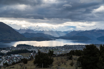 Roys bay at Wanaka with clouds and mountains in view in New Zealand