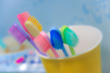 Blurred of colourful kids toothbrush in bathroon
