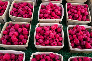 Raspberries for a sale at a farmer's market.