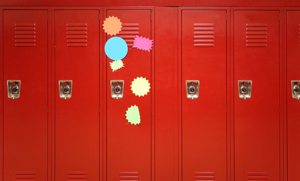 Colorful stickers on red lockers in the school