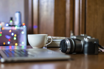 close up camera on the table of photographer workplace with laptop f