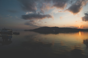 Calm Sea Water, Cloudy Sky and Beautiful Sunrise Morning