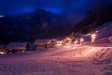 Fotobehang mountain village in alps  at night © .shock
