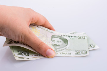 Hand holding 20 Turksh Lira banknote  in hand