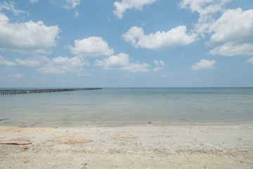 Fototapeta na wymiar Clear Sea Water, White Sand, Cloudy Sky and Tropical Beach
