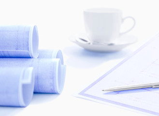 blueprint and coffee cup