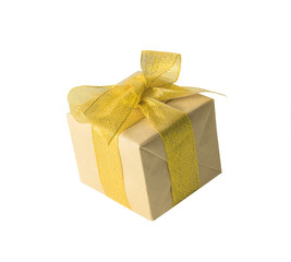 Present or gift box in a craft paper with gold ribbon bow