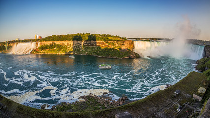 Tourists on boats to see Niagara falls up close