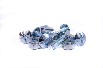 Stainless steel nuts and bolts on an isolated white background.