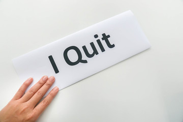 isolated woman submit resignation letter of I quit in office