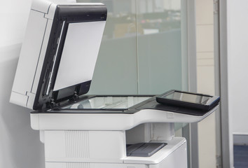 large multi functional printer standing in office for use in copying, scanning and printing