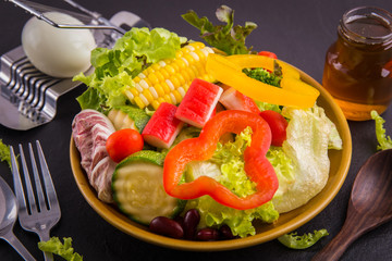 close up,.Salad healthy food on black stone background. .Weight loss.