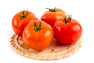 Tomato on wooden tray
