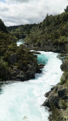 Naklejka na ściany i meble Turquoise Waikato river behind Aratiatia dam near Taupo, New Zealad