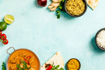 Traditional curry on blue background - obrazy, fototapety, plakaty