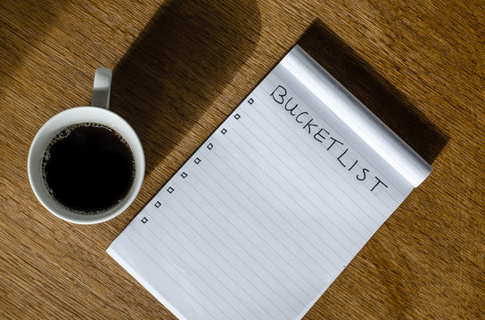 Coffee and a note block with bucket list items