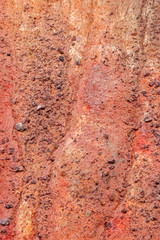 The red texture of the slagheap's slope. Eroded slag of the coal mine