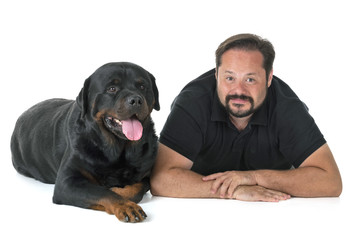 rottweiler and man in studio